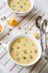 pumpkin soup with pumpkin seeds for a dinner for two
