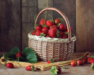 Ripe strawberry in basket on the table.