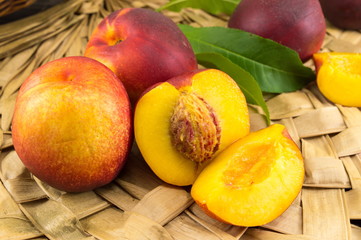 Fresh peaches on wooden surface
