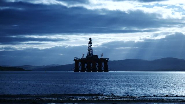 Silhouette of Semi Submersible Oil Rig and Big Boat at Cromarty Firth in Invergordon, Scotland
