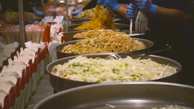 Mixing exotic thai food in slow motion