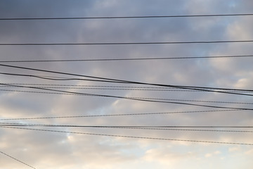 electrical wires on the dawn of the sun