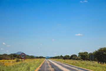 South African road through the savannas and deserts with marking
