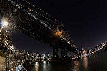 Under the Manhattan bridge at night in New York