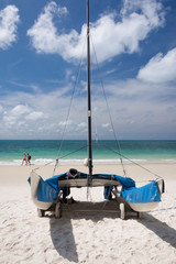 Fototapeta na wymiar Catamaran on the white sands beach.