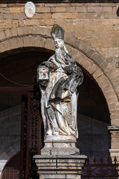 Statue of a bishop in front of the Cefalu Cathedral in Cefalu, Sicily, Italy