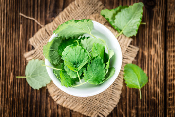 Balm (selective focus) on vintage wooden background