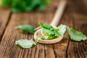 Balm on vintage wooden background