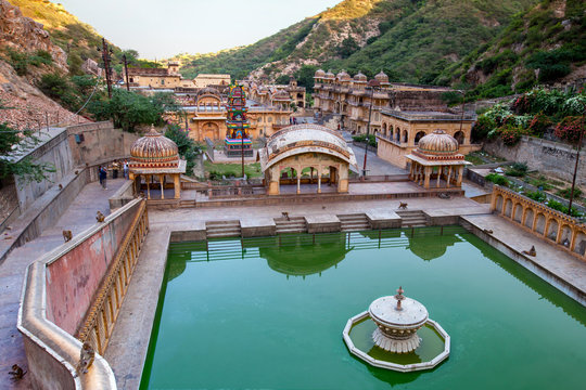 Monkey temple (galtaji) in Jaipur, India. A natural spring emerges high on the hill and flows downward, filling a series of sacred kunds in which pilgrims bathe