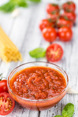 Tomato Sauce (selective focus) on vintage wooden background