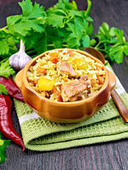 Rice with chicken and zucchini in bowl on napkin