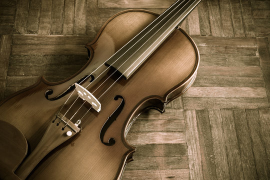 vintage classical violin on wooden floor for music background