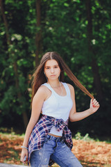 Fototapeta premium young beautiful girl walking park