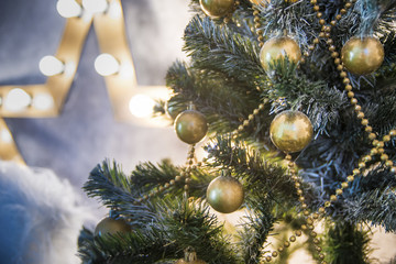 Decorations on the Christmas tree branches with shallow depth of field