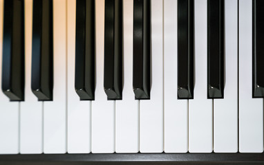 Naklejka premium Close up shot of black & white grand piano Keys 
