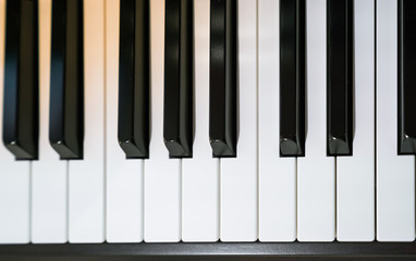 Close up shot of black & white grand piano Keys
