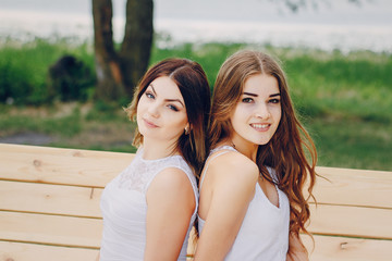 two girls resting on the beach