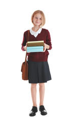 Schoolgirl with books and bag isolated on white