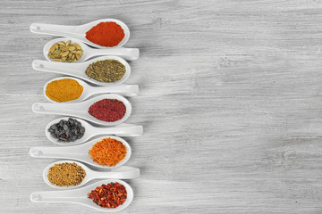 Aromatic spices on wooden background