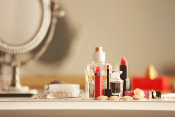 Fototapeta na wymiar Cosmetics on dressing table, closeup