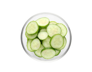 Sliced cucumber in bowl on white background