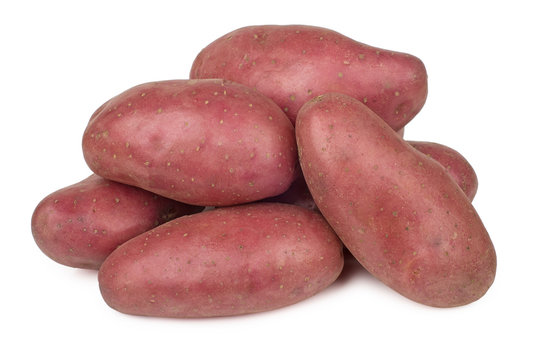 Heap of raw red potatoes isolated on white