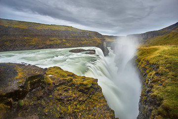 Fototapeta premium cloudy sunrise with the stunning waterfall at Gullfoss waterfall, iceland 