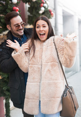 Young couple in shopping looking for Christmas and New Year gift