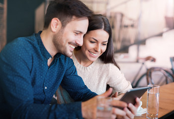 Young couple drinking cofee in a cafe