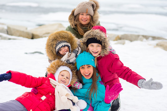 Group of young girls on the frozen lake