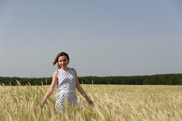 Young woman in wheat field