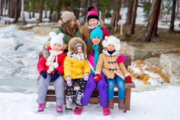 Group of young girls sitting at the bench