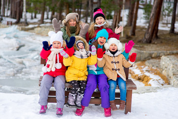 Group of young girls sitting at the bench