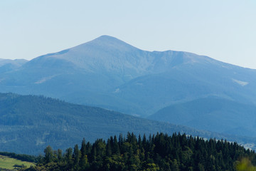 Obraz premium Isolated on blue sky mountain peaks