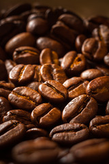 Closeup of coffee beans. Vertical edit.