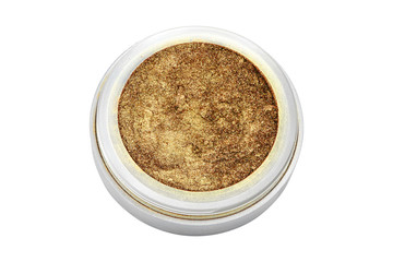 Golden color eyeshadow powder with glitter particles, in round grey open container, frontal view, beauty product isolated on white background