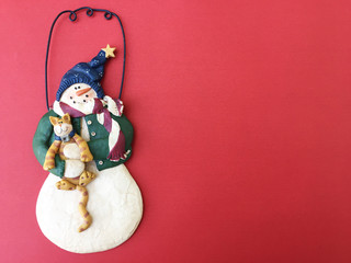 Snowman home decoration toy Merry Christmas on red background