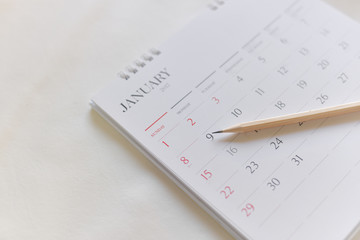 Blurred calendar page in over white tone.JANUARY