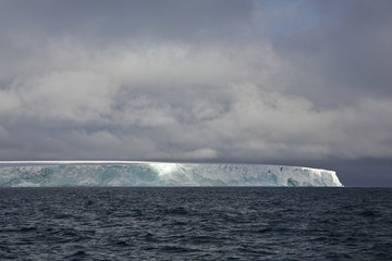 Edge of the Arctic island covered with glacier 
