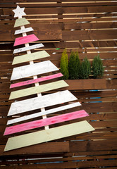 Christmas background with fir and wooden Christmas tree