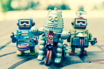 Old robot toy, vintage color style, vintage tone background.
