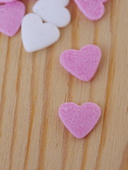 candy hearts wood background