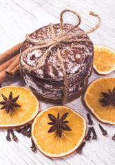 Gingerbread cookies, cinnamon and orange slices. Christmas decoration.