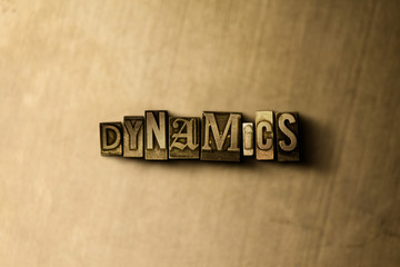 Naklejka premium DYNAMICS - close-up of grungy vintage typeset word on metal backdrop. Royalty free stock - 3D rendered stock image. Can be used for online banner ads and direct mail.