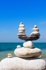 Concept of harmony and balance. Balance stones against the sea.