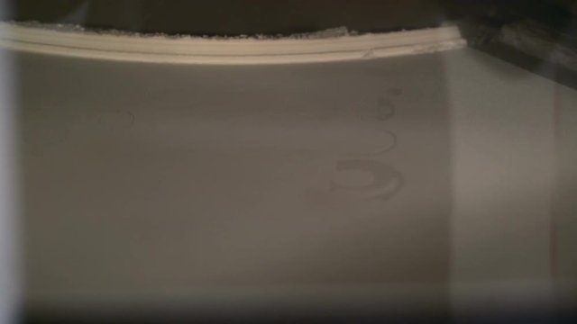3D Printer during work. Selective laser sintering is an additive manufacturing technique that uses a laser as the power source to sinter powdered material.