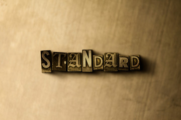 STANDARD - close-up of grungy vintage typeset word on metal backdrop. Royalty free stock - 3D rendered stock image.  Can be used for online banner ads and direct mail.