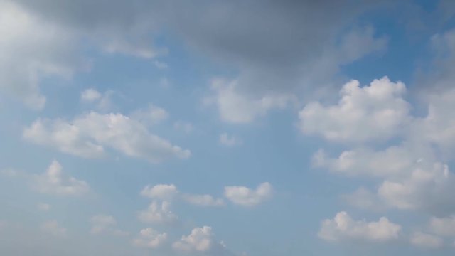 Fluffy white clouds on sky with a bright ,Slow-moving,Time Lapse.