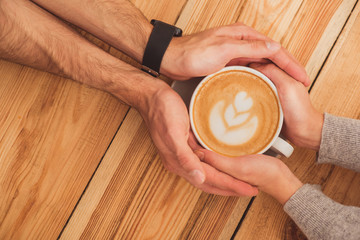 Cute loving couple dating in cafe