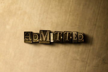 Naklejka premium ADMITTED - close-up of grungy vintage typeset word on metal backdrop. Royalty free stock - 3D rendered stock image. Can be used for online banner ads and direct mail.